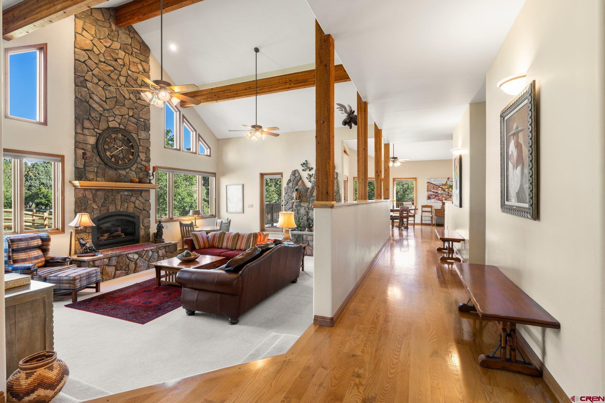 747 Oak Drive Durango, CO 81301 - Photo 5 of 34 a living room with furniture fireplace and a large window