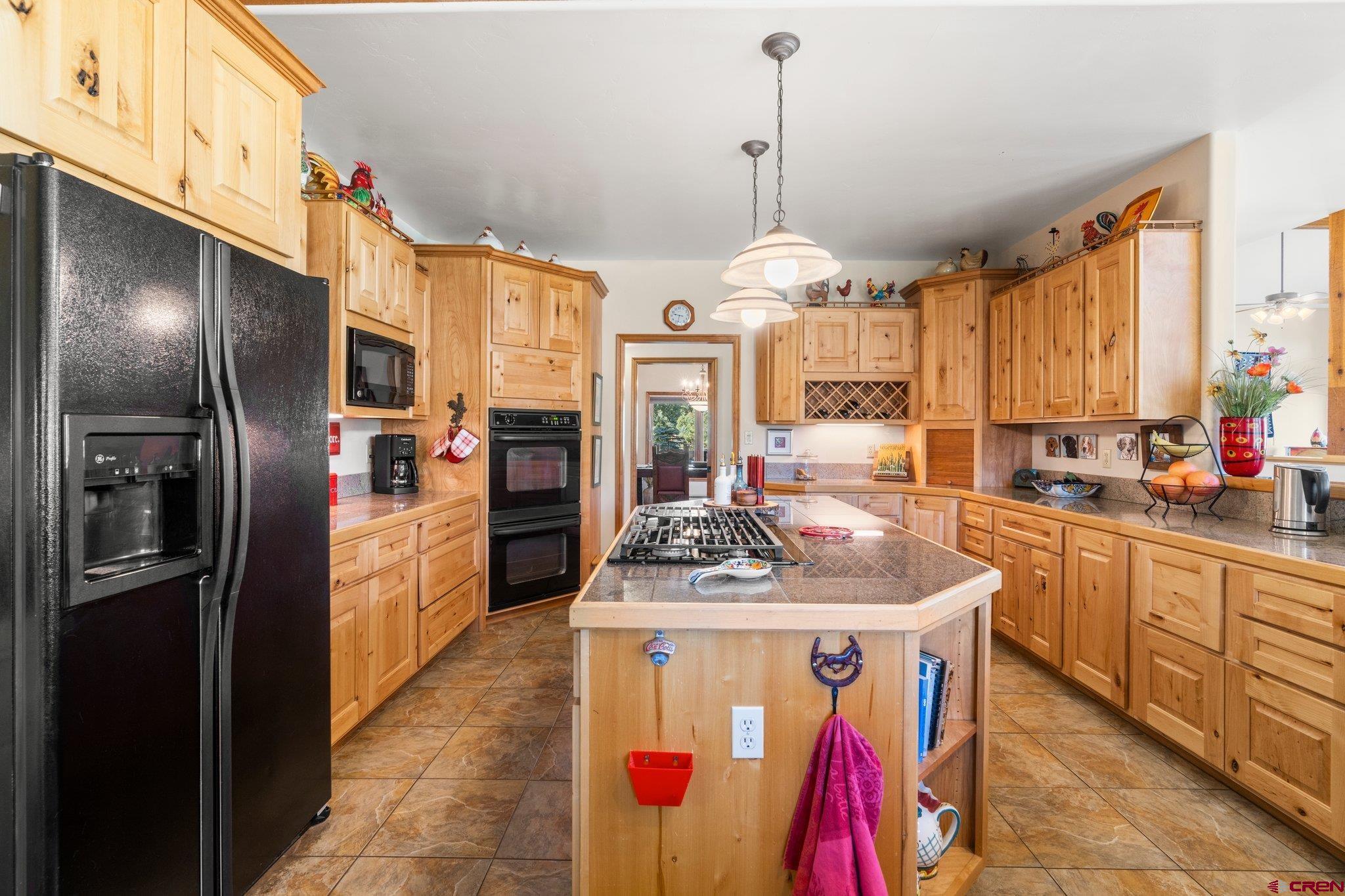 747 Oak Drive Durango, CO 81301 - Photo 7 of 34 a kitchen with stainless steel appliances granite countertop a sink a counter space cabinets and stainless steel appliances