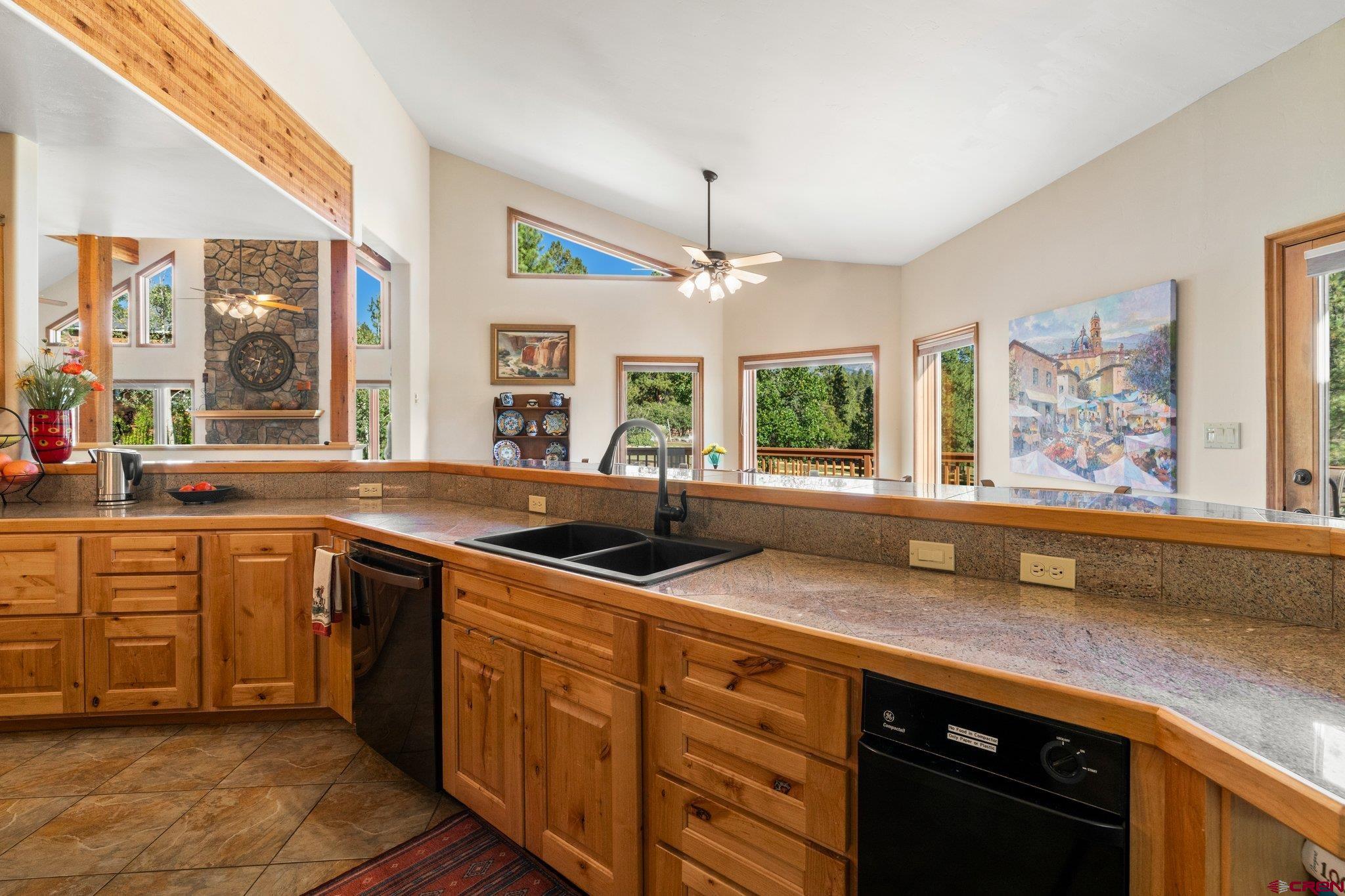 747 Oak Drive Durango, CO 81301 - Photo 8 of 34 a kitchen with stainless steel appliances granite countertop a sink stove and cabinets