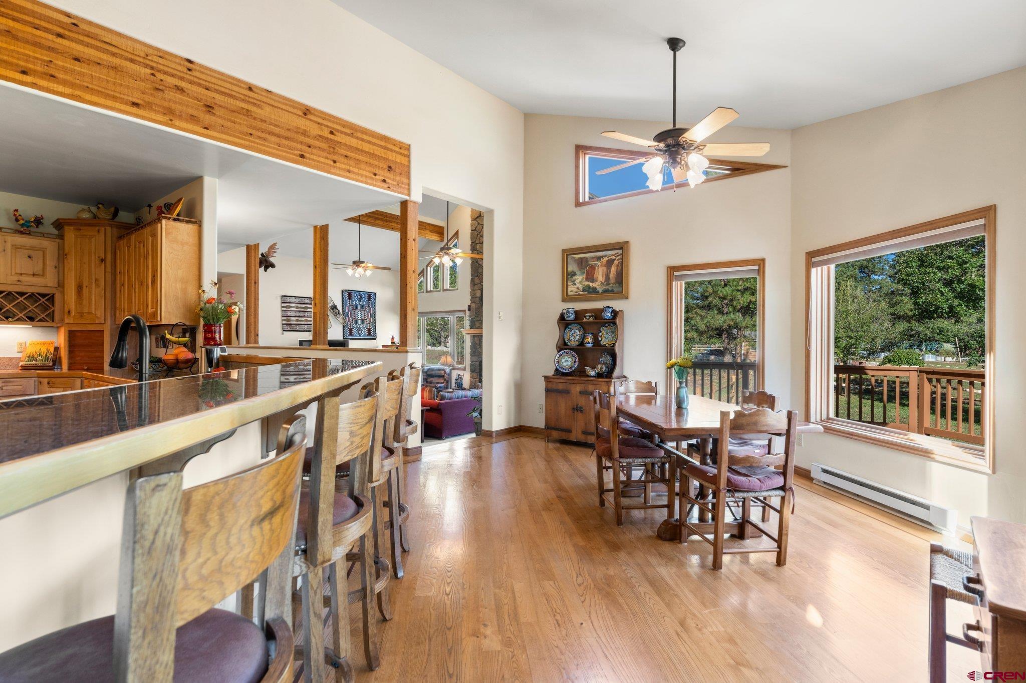 747 Oak Drive Durango, CO 81301 - Photo 10 of 34 a view of a dining room with furniture window and wooden floor