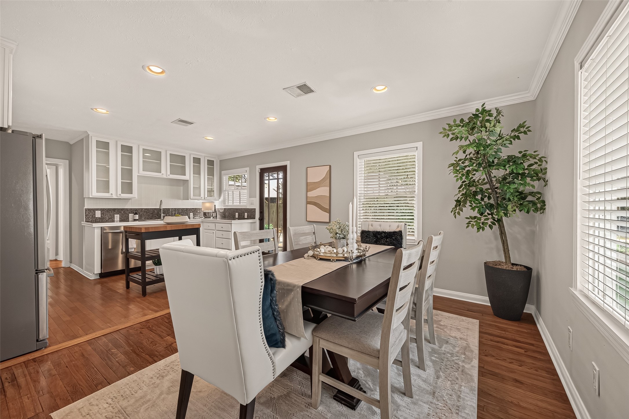 2019 Gostick Street Houston, TX 77008 - Photo 4 of 36 a view of a dining room with furniture window and wooden floor