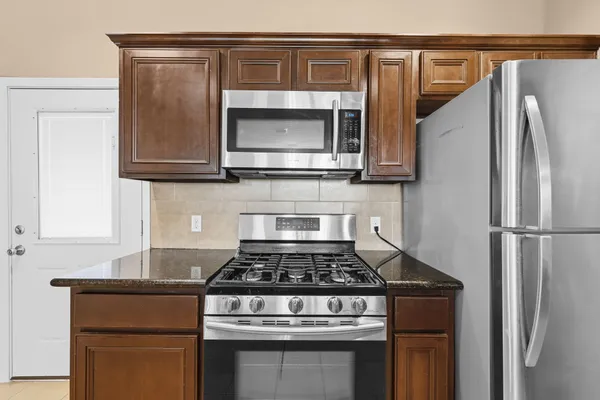 a kitchen with a stove and a microwave