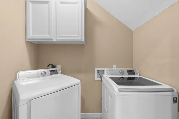 a utility room with dryer and washer