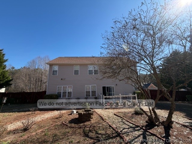 8836 Looking Glass Road Linden, NC 28356 - Photo 22 of 22 a front view of a house with yard fire pit and outdoor seating