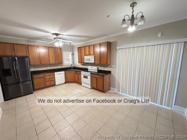 8836 Looking Glass Road Linden, NC 28356 - Photo 5 of 22 a kitchen with stainless steel appliances granite countertop a refrigerator a oven a sink with island and chairs