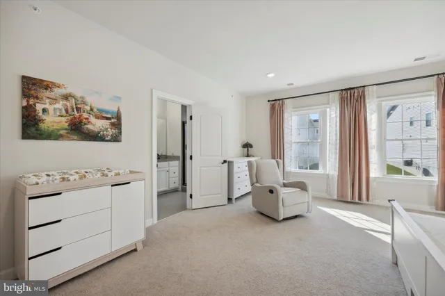a hallway with a couch and dresser