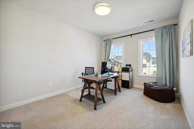 a workspace with furniture and a window