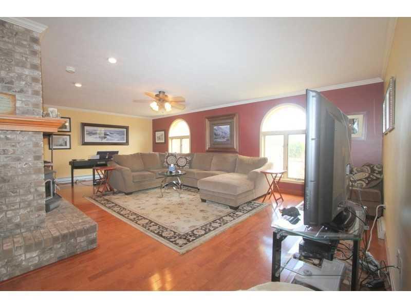 458 School Road Clinton, PA 15026 - Photo 14 of 25 Family Room. Beautiful wood flooring, brick fireplace, and large windows make this spacious yet cozy Family Room a light, bright, and comfortable place to relax.