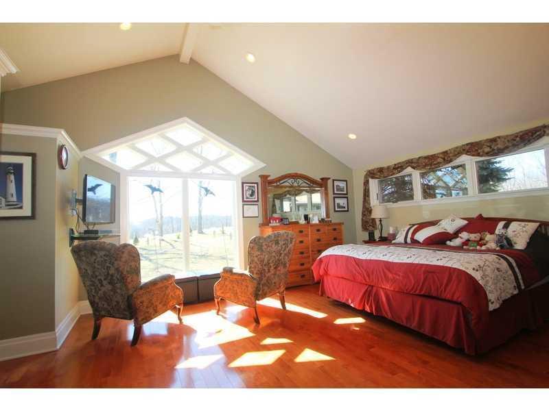 458 School Road Clinton, PA 15026 - Photo 16 of 25 Master Bedroom. Gorgeous wood flooring in the Master Bedroom is insulated. Vaulted ceilings give a spacious feel and the large window offers a fabulous view. Two walk-in closets plus built-in cabinetry give the 22x15 Master Bedroom some very attractive storage space.