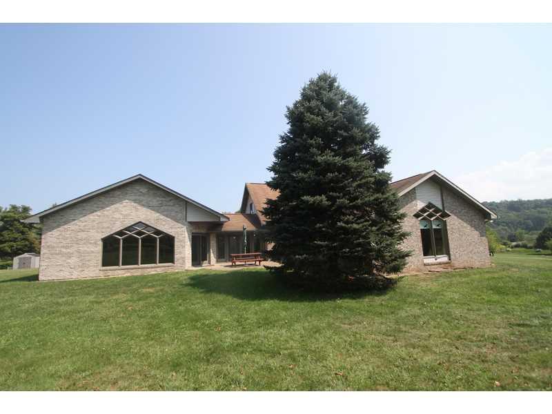 458 School Road Clinton, PA 15026 - Photo 3 of 25 Exterior Front. The back of this incredible home is bordered with a large level yard and a fruit orchard. The property goes down to the River/Racoon Creek and across the river !