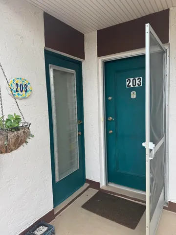 a kitchen with a table and chairs