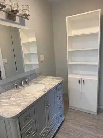 an empty room with wooden floor and closet