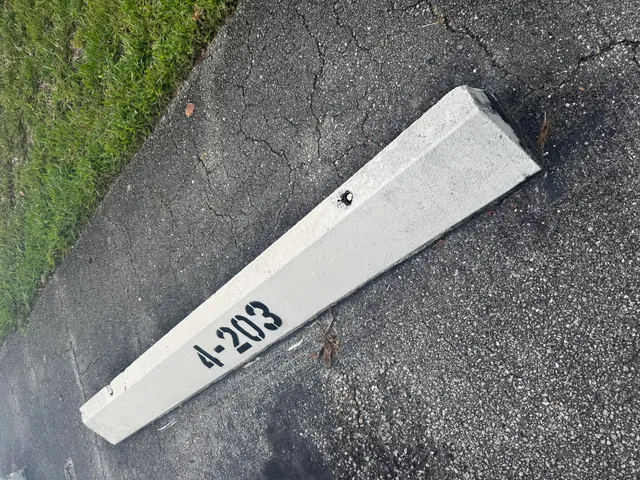 a kitchen with stainless steel appliances granite countertop a table chairs sink and cabinets