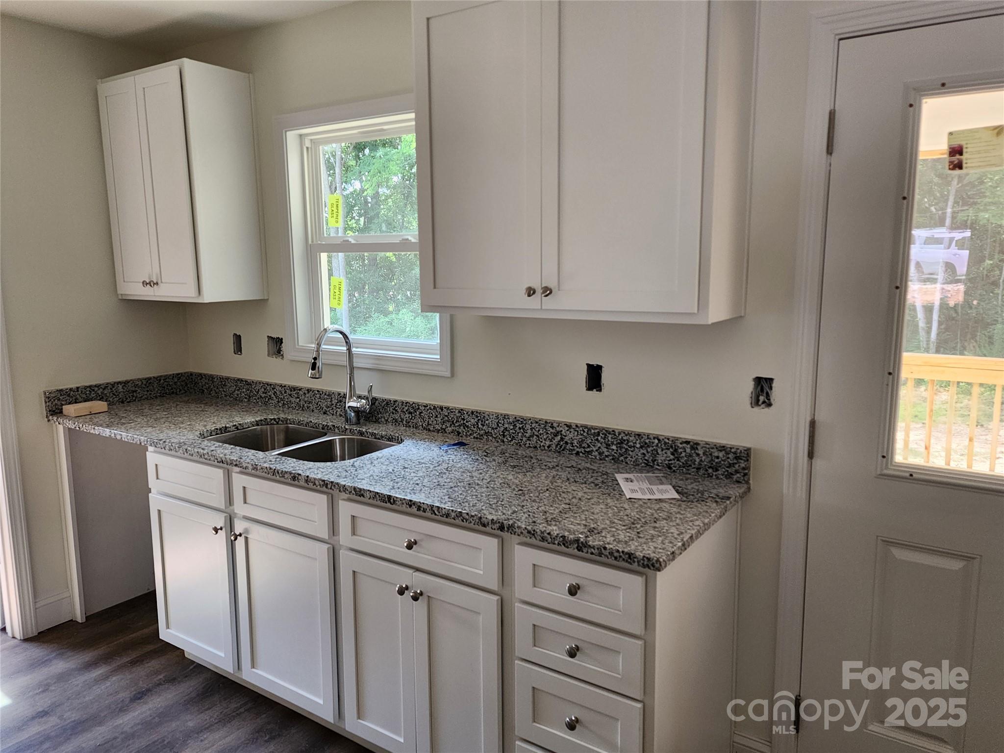 150 Hinton Street Chester, SC 29706 - Photo 22 of 22 a kitchen with granite countertop white cabinets and sink