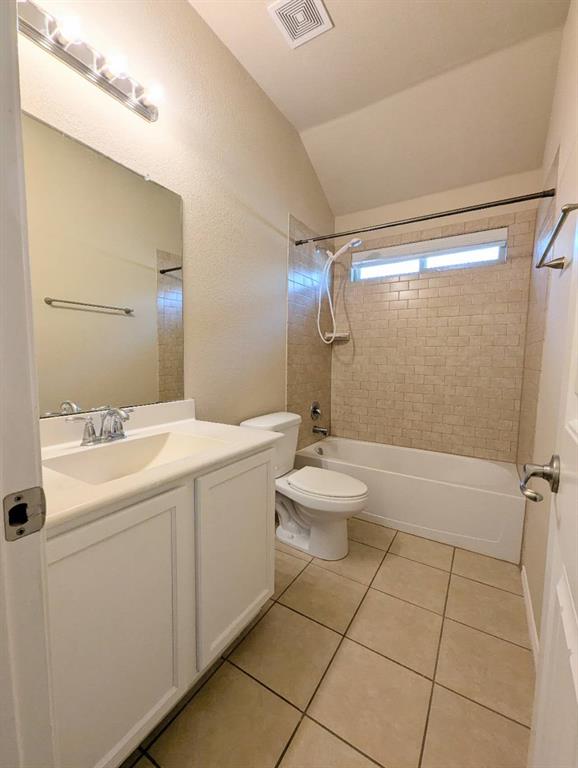 2110 Spruce Street Anna, TX 75409 - Photo 3 of 13 a bathroom with a sink a toilet and shower
