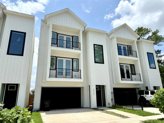 a front view of a house with yard