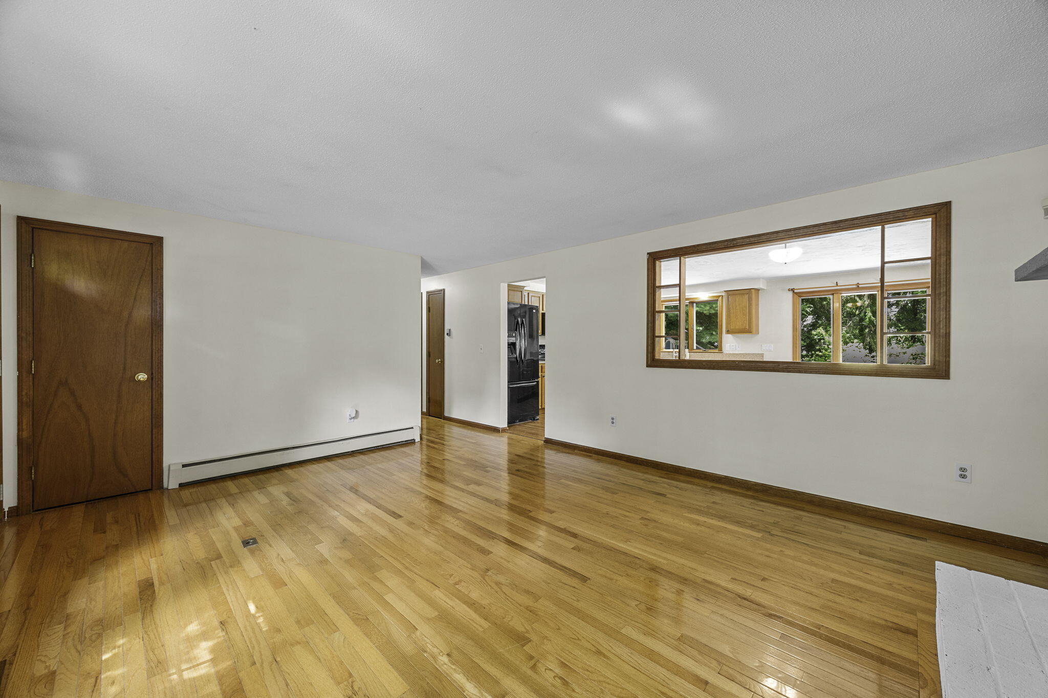 5 Carl Gardner Road Monument Beach, MA 02532 - Photo 13 of 29 a view of an empty room with wooden floor and a window