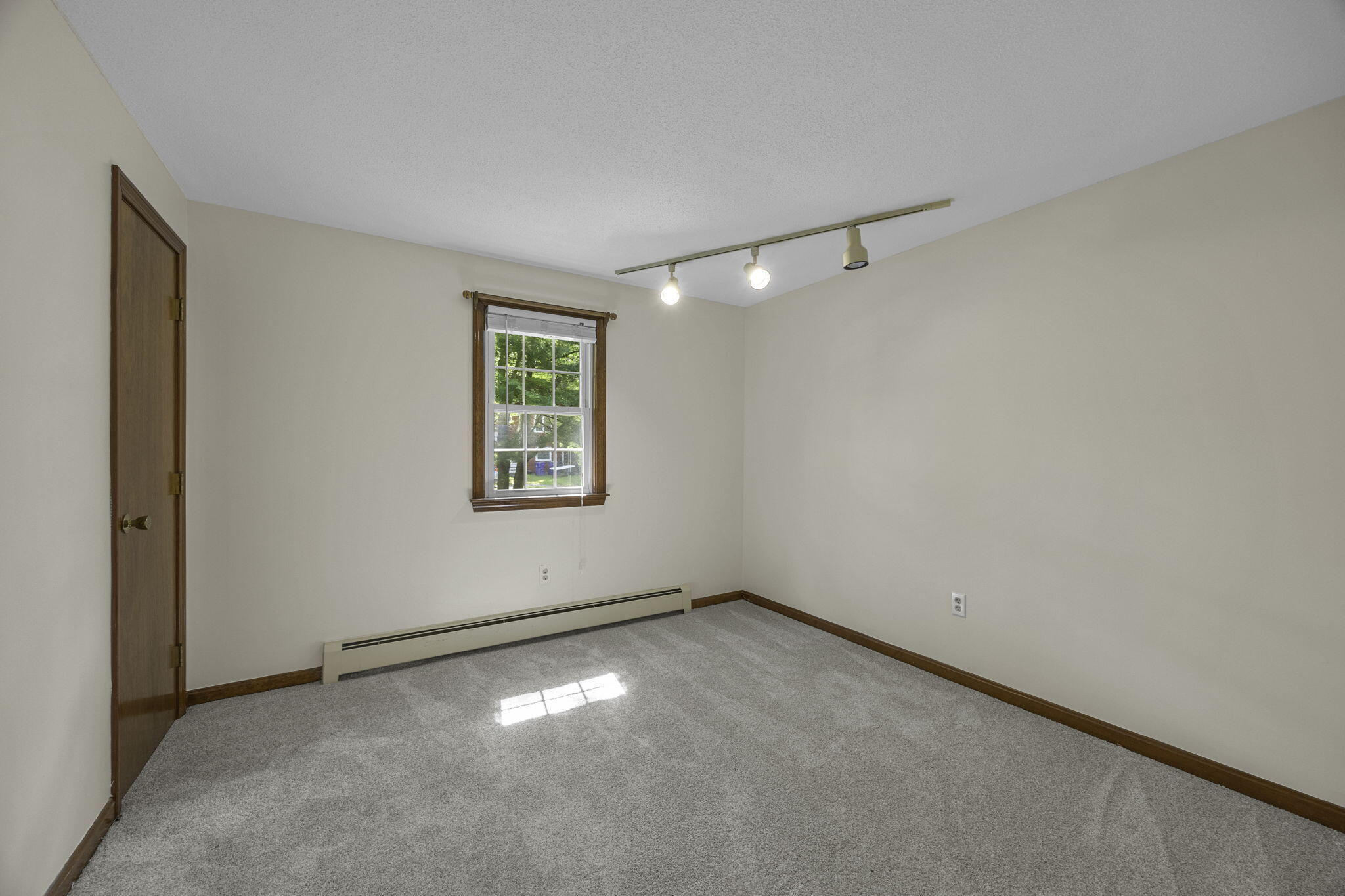 5 Carl Gardner Road Monument Beach, MA 02532 - Photo 18 of 29 an empty room with a empty space and windows