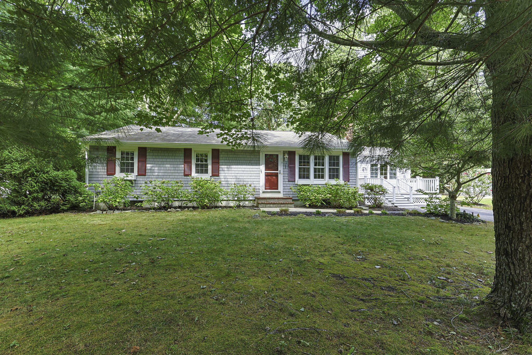 5 Carl Gardner Road Monument Beach, MA 02532 - Photo 2 of 29 a front view of house with yard and green space