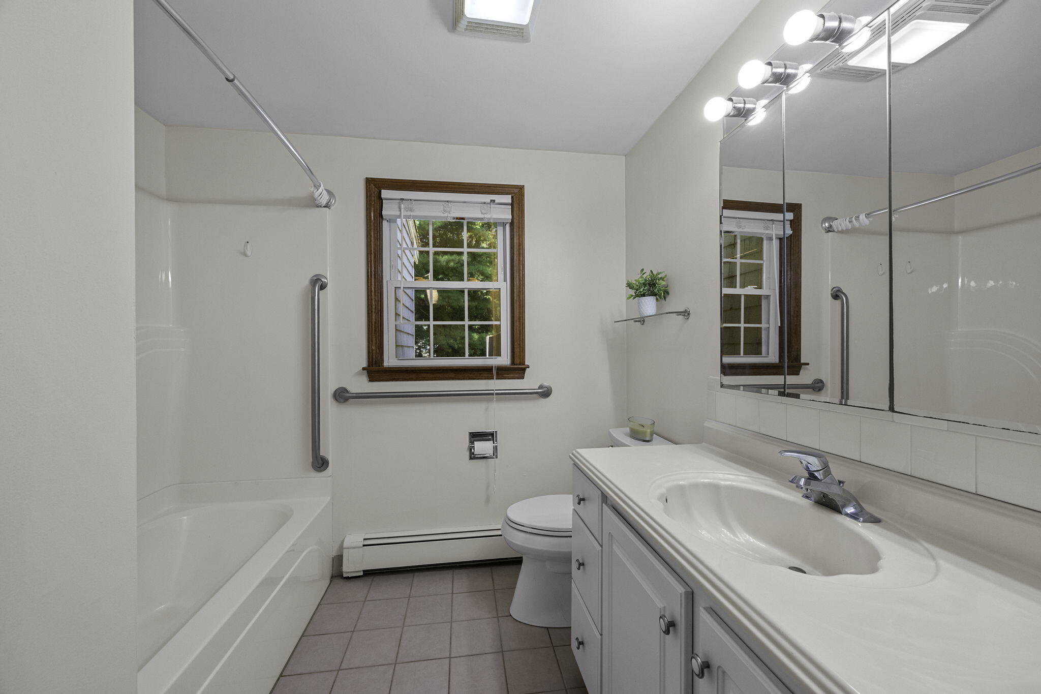 5 Carl Gardner Road Monument Beach, MA 02532 - Photo 21 of 29 a bathroom with a granite countertop sink toilet and shower