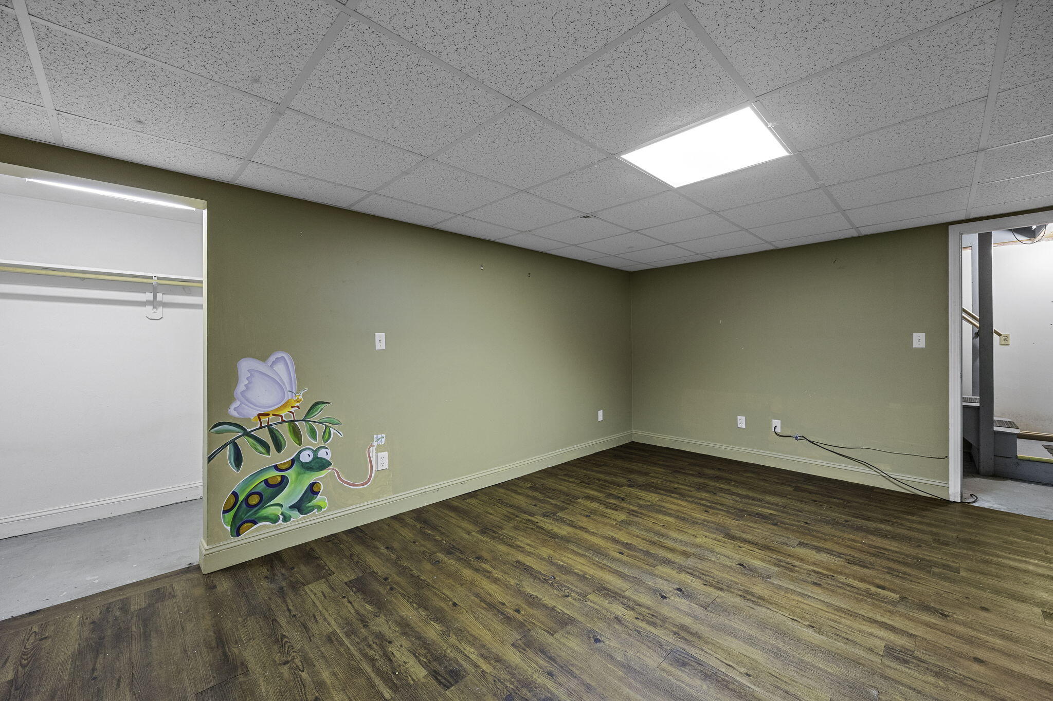 5 Carl Gardner Road Monument Beach, MA 02532 - Photo 22 of 29 a view of an empty room with wooden floor and a window