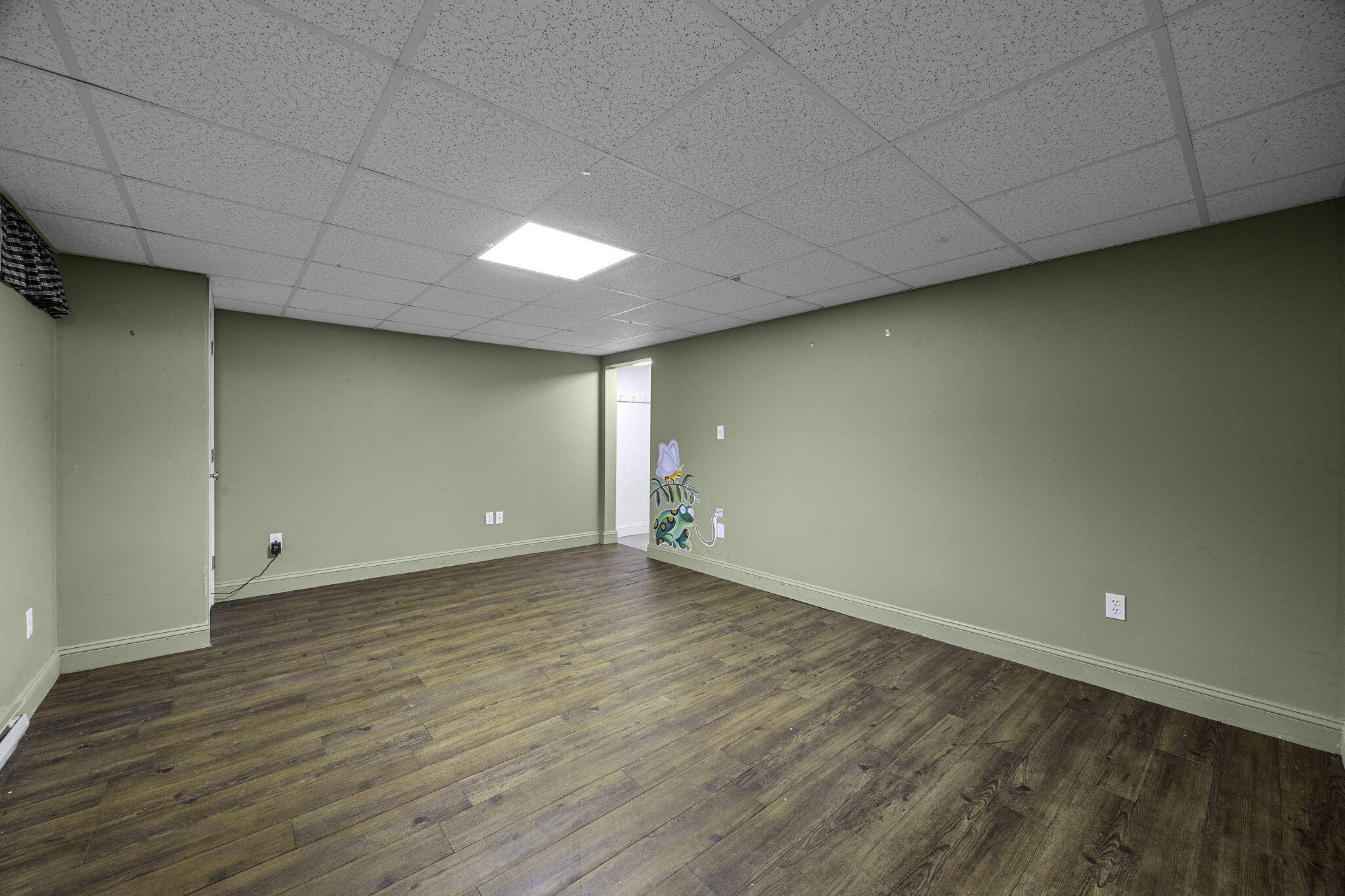 5 Carl Gardner Road Monument Beach, MA 02532 - Photo 23 of 29 a view of an empty room with wooden floor