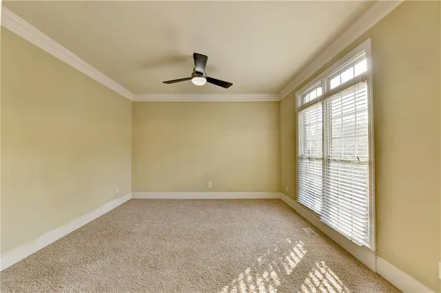 a kitchen with stainless steel appliances kitchen island granite countertop a stove a sink dishwasher a refrigerator and white cabinets with wooden floor