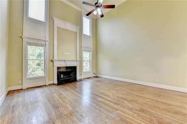 a bathroom with a sink a toilet a mirror a vanity a bathtub and shower
