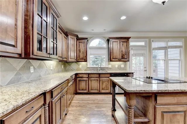 a view of an empty room with a fireplace and a window