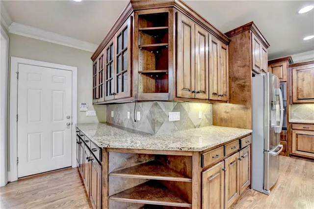 a spacious bathroom with a double vanity sink a large mirror and shower