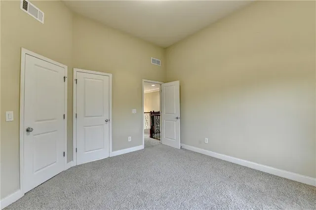 an aerial view of a house with a yard and garden