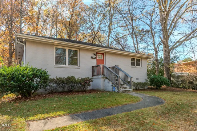 a house view with a backyard space