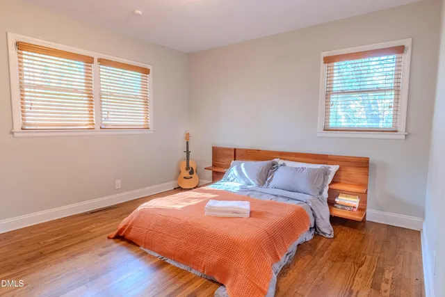 a bedroom with bed and window