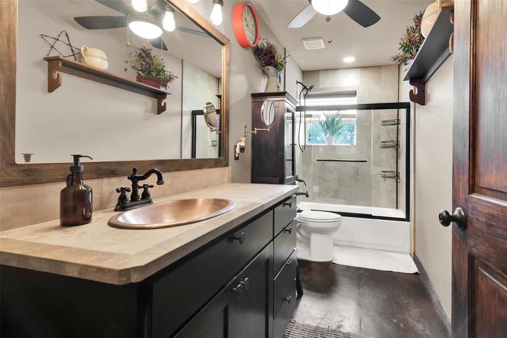8665 Cr-669 Blue Ridge Blue Ridge, TX 75424 - Photo 17 of 39 a bathroom with a granite countertop sink toilet and shower