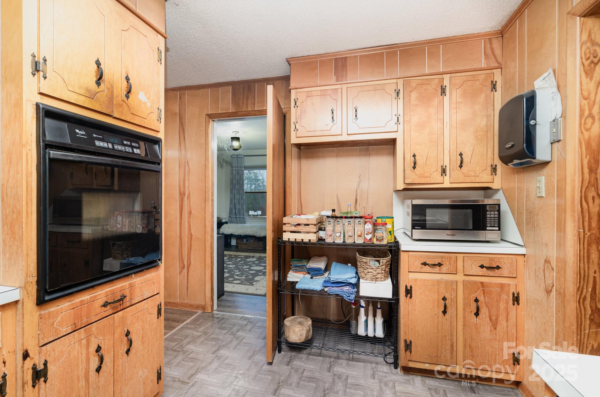 4458 Johnson Bridge Road Hickory, NC 28602 - Photo 15 of 31 a kitchen with stainless steel appliances a stove microwave and refrigerator