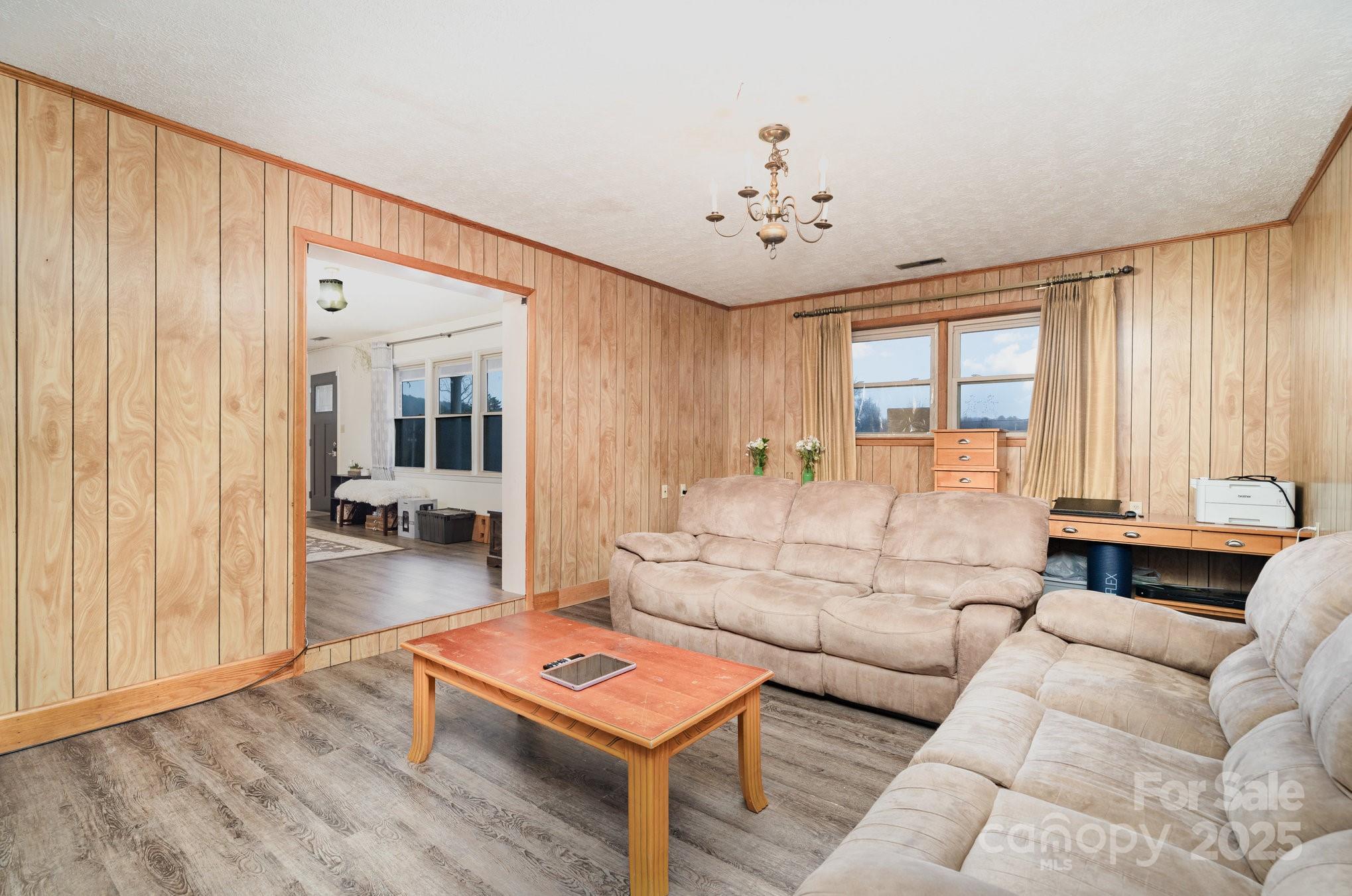 4458 Johnson Bridge Road Hickory, NC 28602 - Photo 17 of 31 a living room with furniture and a large window