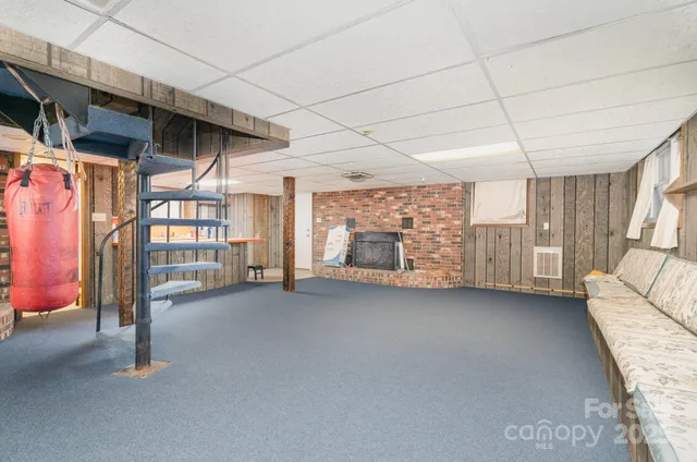 a view of an empty room with a fireplace