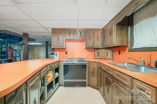 a kitchen with stainless steel appliances granite countertop a sink and cabinets