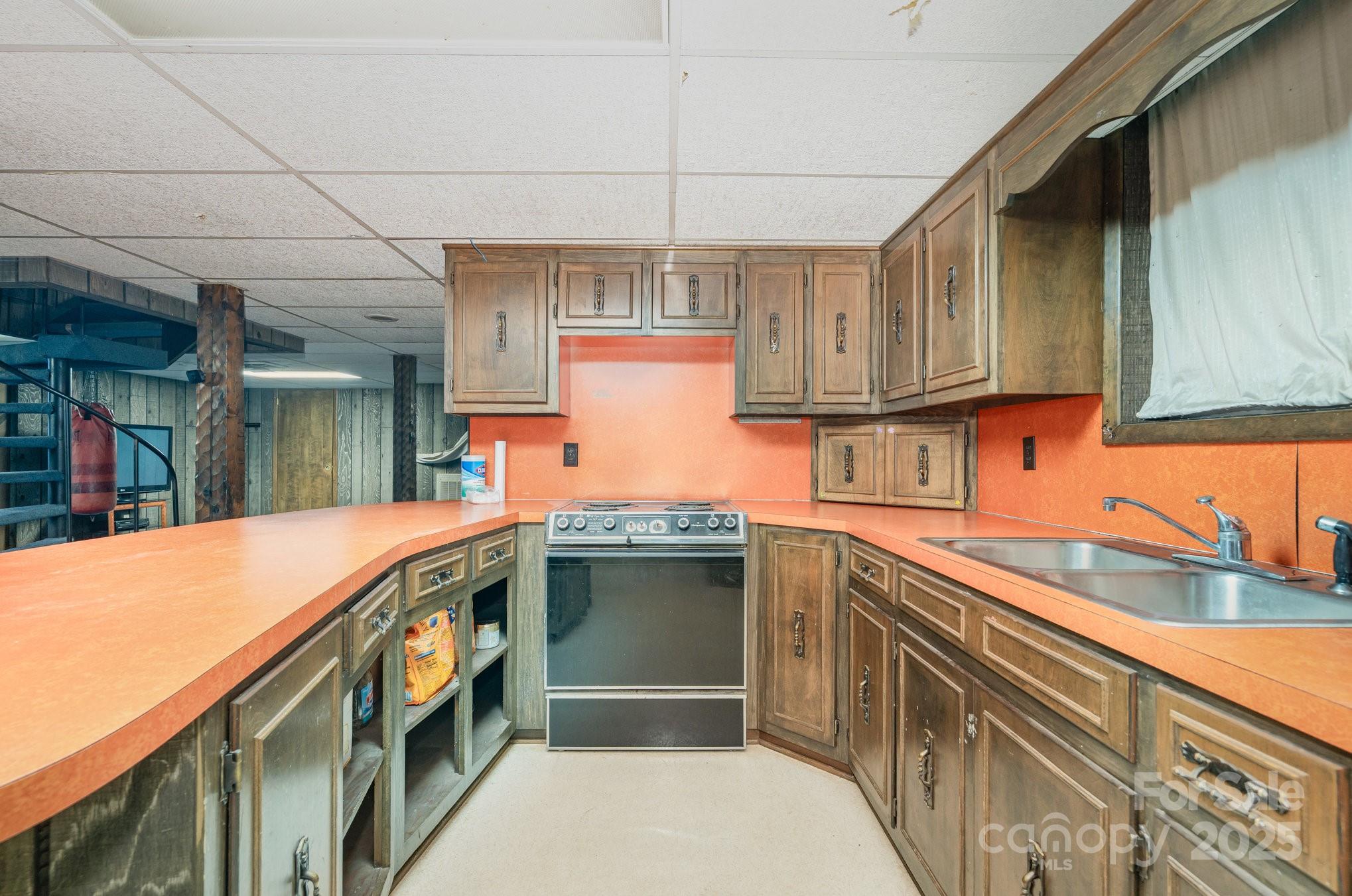 4458 Johnson Bridge Road Hickory, NC 28602 - Photo 28 of 31 a kitchen with stainless steel appliances granite countertop a sink and cabinets