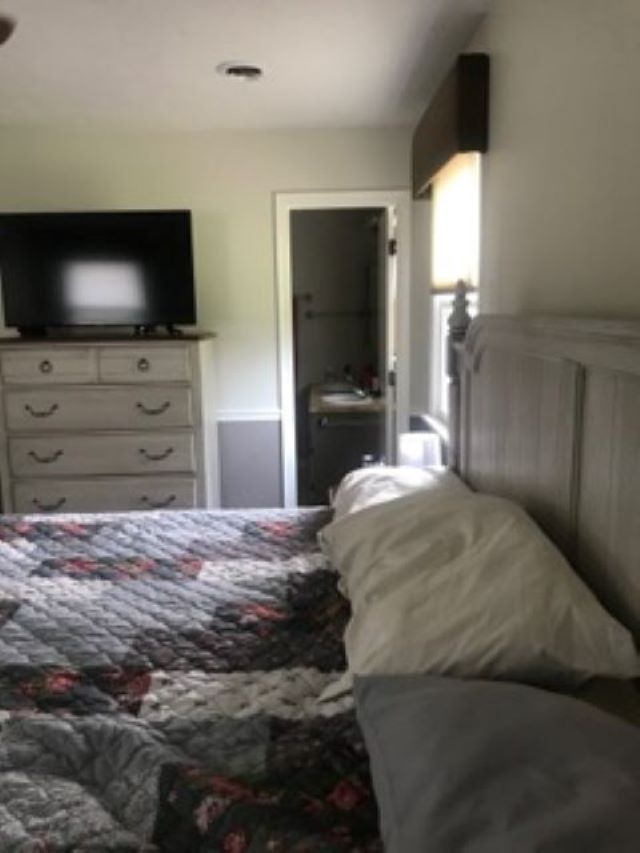961 Ladd Road Waynesboro, VA 22980 - Photo 11 of 30 a bedroom with a bed and a flat screen tv