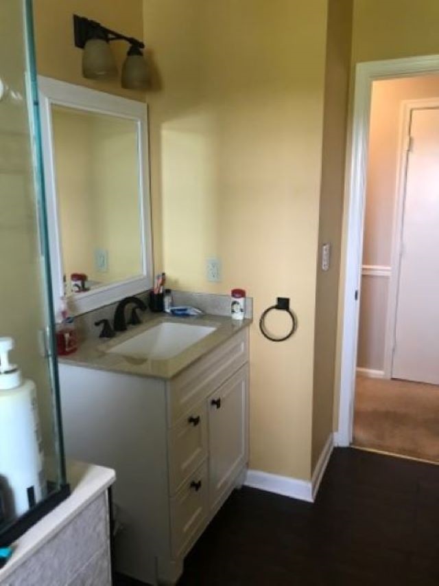 961 Ladd Road Waynesboro, VA 22980 - Photo 17 of 30 a bathroom with a granite countertop sink and a mirror