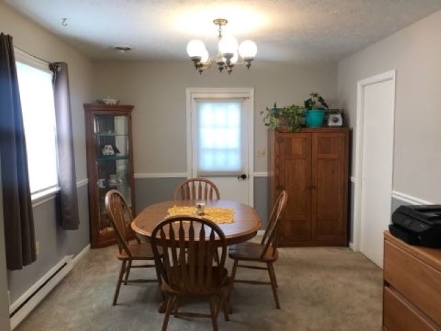 961 Ladd Road Waynesboro, VA 22980 - Photo 5 of 30 a dining room with furniture a chandelier and window