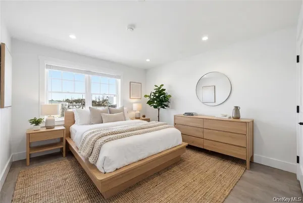 a bedroom with bed and a window