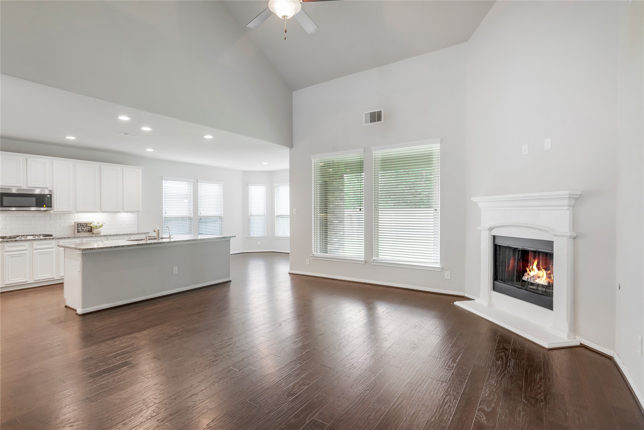 23018 Southern Brk Trail Spring, TX 77389 - Photo 12 of 43 Living room is open to the kitchen.