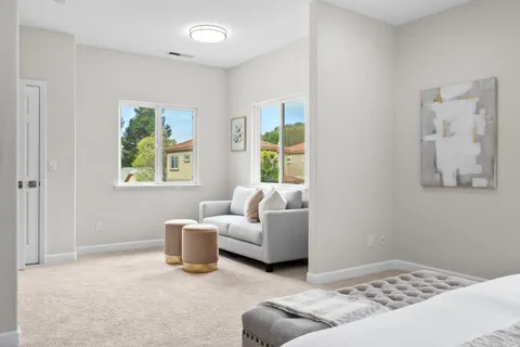 a living room with furniture and window