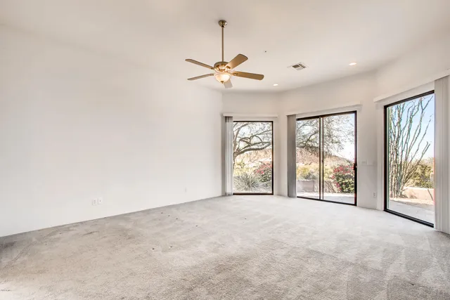 a bathroom with a granite countertop tub sink double vanity granite tub shower and mirror