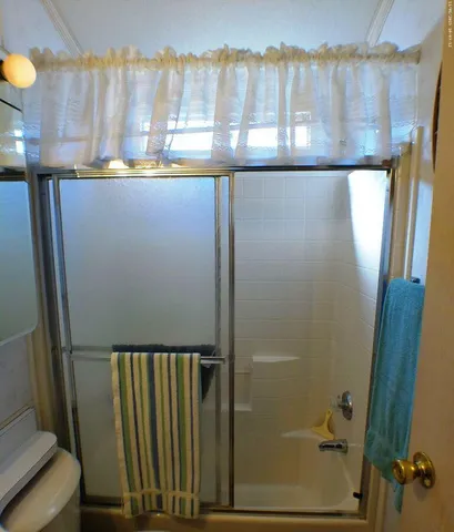 a view of a bathroom with a sink and a window