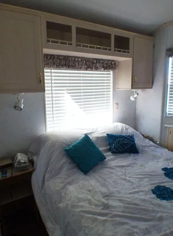 a bedroom with a bed and window