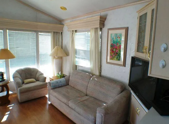 a living room with furniture and a window