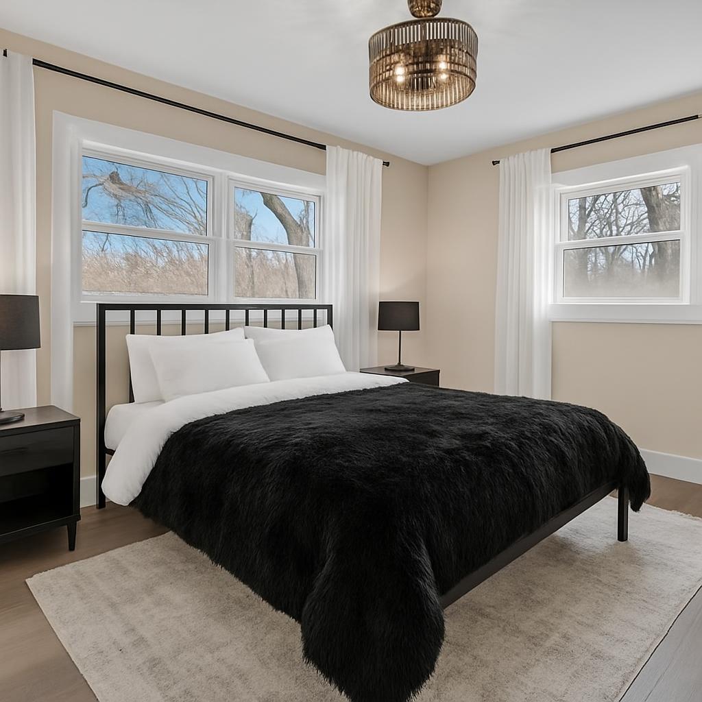 1952 Hayes Leonard Road Valparaiso, IN 46385 - Photo 11 of 42 a bedroom with a large bed and a chandelier